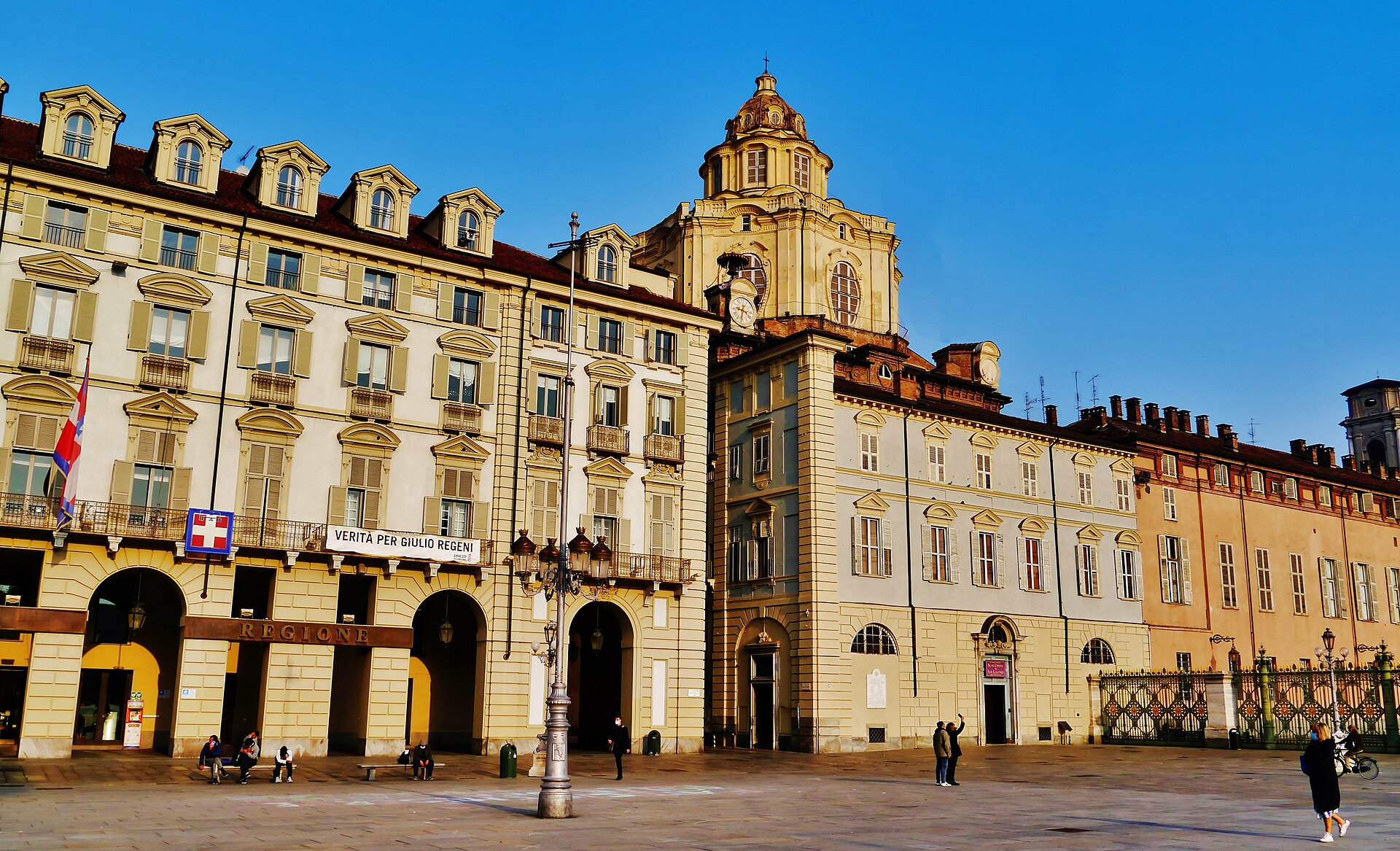 San Lorenzo seen from Piazza Castello, Turin: a flat palace front with a single plain door, the dome hidden behind it